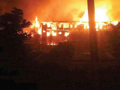 A government building set ablaze during the protests