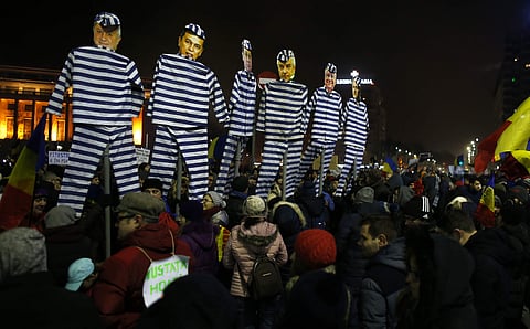 People carry effigies depicting members of Romanian government during a demonstration in Bucharest, Romania, Sunday, Feb. 5, 2017.  | AP
