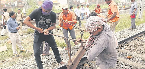 Railway gangmen alternatively called as track maintainers perform their task in Chennai | Romani Agarwal