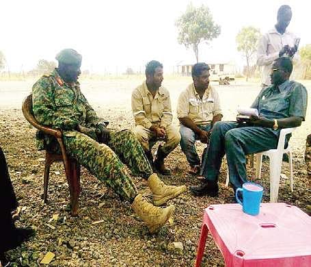 The engineers with their captors attached to the Sudan People’s Liberation Army-In Opposition