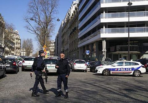 Police officers take position after letter bomb exploded at the French office of the International Monetary Fund. (Photo | AP)