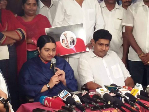 Madhavan, seen along with her wife Deepa while addressing a press confrerence during the launch of MGR Amma Deepa Peravai in February. Madhavan today announced him quitting the outfit.   (File photo | EPS)
