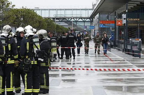 Police officers, rescue workers, left, and soldiers patrol outside the Orly airport. (Photo | AP)