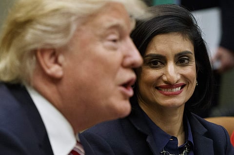 Administrator of the Centers for Medicare and Medicaid Services Seema Verma listen at right as President Donald Trump speaks during a meeting on women in healthcare. AP