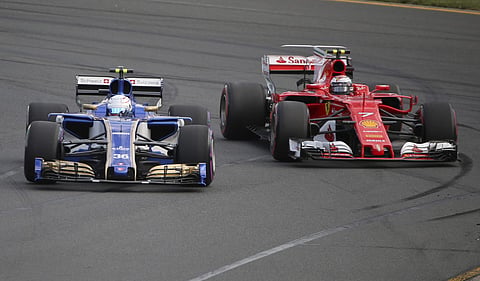 Saber reserve driver Antonio Giovinazz, left, leads Ferrari driver Kimi Raikkonen of Finland during qualifying for the Australian Formula One Grand Prix in Melbourne, Australia, Saturday, March 25, 2017. | AP