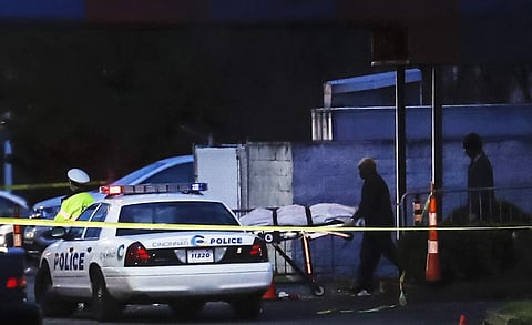 A body is removed as police work at the Cameo club after a fatal shooting, Sunday, March 26, 2017, in Cincinnati.  | AP