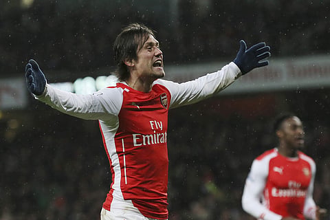 A Friday, Dec. 26, 2014 file photo of Arsenal's Tomas Rosicky celebrating after scoring a goal during the English Premier League soccer match between Arsenal and Queens Park Rangers at the Emirates Stadium, London. | AP