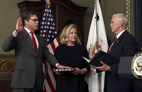 Vice President Mike Pence administers the oath of office to Energy Secretary Rick Perry as his wife Anita holds the Bible, Thursday, March 2, 2017, in the Eisenhower Executive Office Building on the White House complex in Washington.  | AP