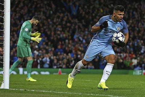 Manchester City's Sergio Aguero celebrates after scoring his side's second goal during the Champions League round of 16 first leg soccer match. | AP