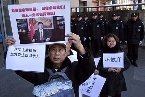 Relatives of passengers onboard the missing Malaysia Airlines Flight 370 demand for the Chinese government to continue the search. (Photo | AP)