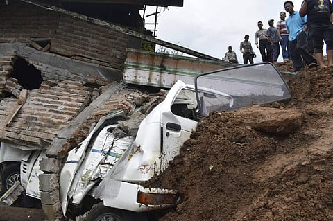 Rescuers inspect the damage in a neighborhood hit by a landslide in the village of Banaran, Ponorogo, East Java, Indonesia, Saturday, April 1, 2017. (Photo | AP)