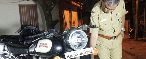 A police official inspecting the student’s bike | S Manjunath