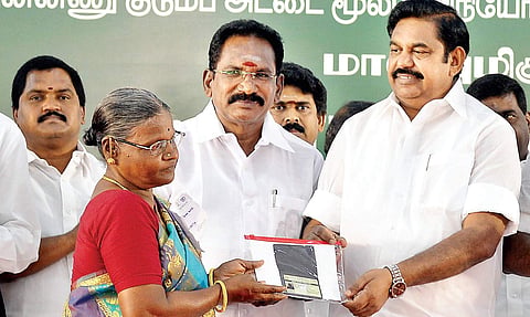 Chief Minister Edappadi K Palaniswami distributing a Smart ration card at Korattur on Saturday | D SAMPATHKUMAR