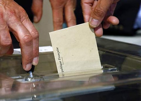 Frontrunners Macron, Le Pen vote in French election