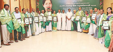 Chief Minister Edappadi K Palaniswami with the winners of Thamizh Chemmal awards for 2015, at the Secretariat on Tuesday
