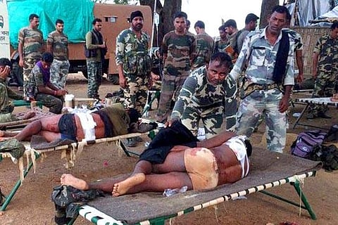 Injured jawans of Special Task Force being provided medical help after an encounter with Maoists in Pedmal forest in Chhattisgarh's Sukma district. (File |PTI)