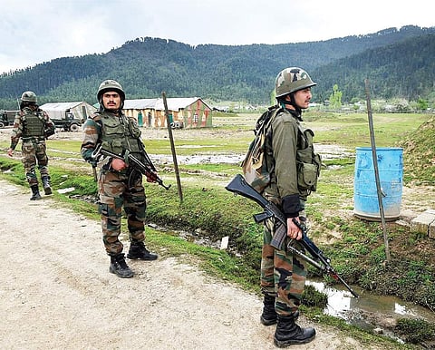 Army personnel stand guard outside the Panzgam Army camp which was attacked by militants in Kupwara in Jammu and Kashmir on Thursday. | PTI