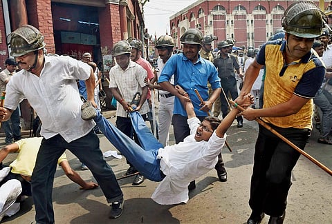 Police detain a Congress activist during a protest against TMC leaders involved in the Narada scam, in Kolkata.(File | PTI)