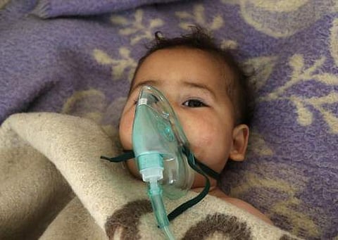 A Syrian child receives treatment following a suspected toxic gas attack in Khan Sheikhun, a rebel-held town in the northwestern Syrian Idlib province, on April 4, 2017. (AFP)