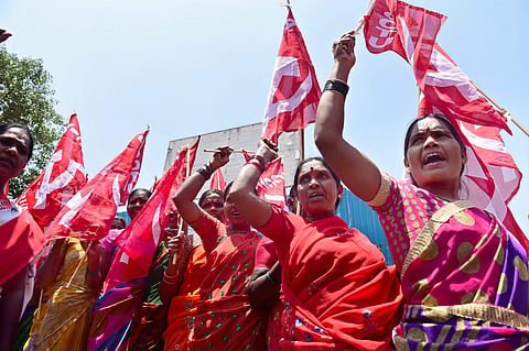 Members of various trade unions take part in a rally to mark the International Labour Day also known as May Day in Bengaluru on Monday. (PTI)