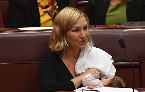 Australian Greens party Sen. Larissa Waters breastfeeds her baby Alia Joy during a session in the Senate Chamber at Parliament House in Canberra, Australia, Tuesday, May 9, 2017. (AP)