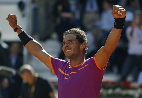 Rafael Nadal of Spain celebrates after defeating Novak Djokovic of Serbia  in their mens semifinal tennis match at the Madrid Open tennis tournament in Madrid, Spain. (AP)
