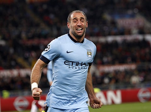 In this Wednesday Dec. 10, 2014 file photo, Manchester City's Pablo Zabaleta celebrates after scoring his side second goal during a Group E Champions League soccer match between Roma and Manchester City at the Olympic stadium in Rome, Italy.  | AP