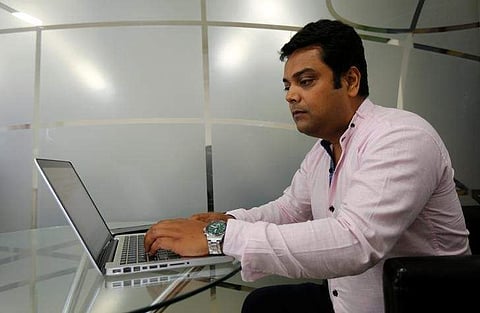 Vineet Pandey, Director of Kaarya Facilities and Services Pvt. Ltd., poses for a photograph at his office in Mumbai. (Photo | Reuters)