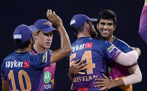 Rising Pune Supergiants bowler Washington Sundar celebrates the wicket of Mumbai Indians batsman Rahul Sharma during the first play off match played against Mumbai Indians in Mumbai on Tuesday. | PTI
