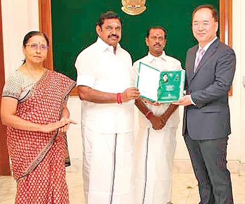 Consul- General of Korea, Hyung Tae Kim receiving the first copy of the Korean translation of Tamil treatise ‘Thirukkural’, authored by saint poet Thiruvalluvar, from CM Edappadi K Palaniswami on Tuesday