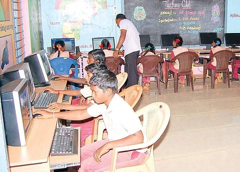 Students working on computers in the Panchayat Union Middle School at Kothavasal in Perambalur district;  | Express