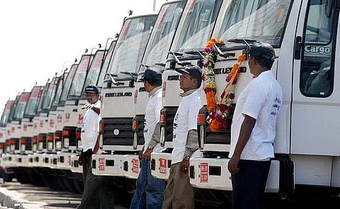 Drivers stand next to Ashok Leyland trucks ready to be exported to Iraq at Bombay port in 2004. (File Photo | Reuters)
