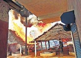 A liquor bar that was set on fire by locals who are against the opening of new outlets, at Soriyankuppam in Puducherry on Wednesday | Express