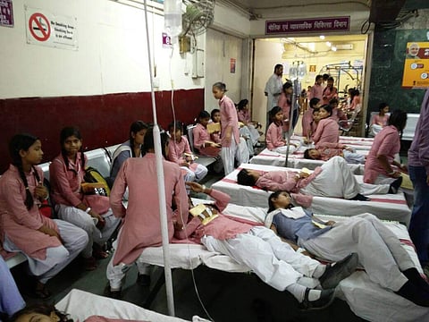 More than 200 students of a government school in Delhi were hospitalised  following a gas leak from a container plant in Tughlakhabad early morning on Saturday. The incident came to light around 7 a.m.  when students complained of irritation in the eye. ( EPS | Shekhar Yadav)