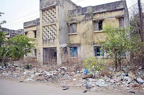 Trash accumulated outside abandoned quarters (