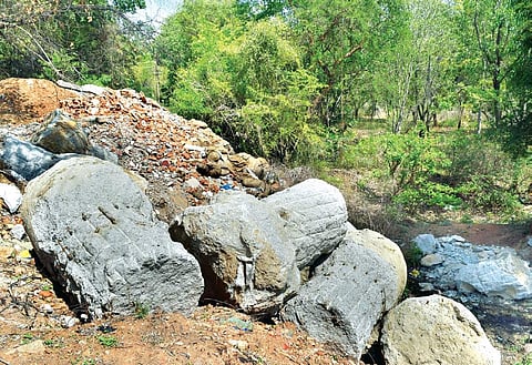 Concrete boulders dumped at Mylasandra Lake-1. The complainant said builders too dump construction debris here | jithendra m