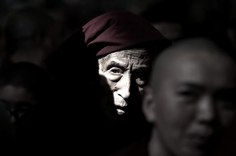 An exile Tibetan Buddhist monk listens to his spiritual leader the Dalai Lama's religious talk at the Tsuglagkhang temple in Dharmsala, India, Monday, June 5, 2017. Each year the Tibetan leader talks to young Tibetans on Buddhist philosophy and religion. 