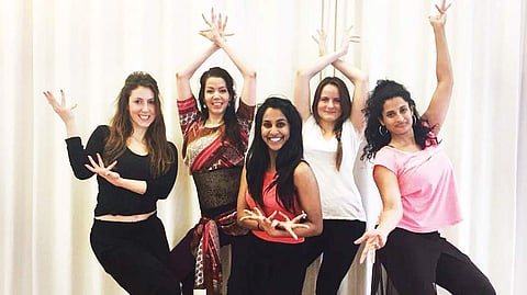Kavya with her dance troupe in the US