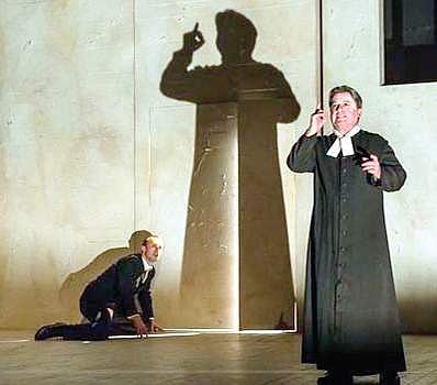 Johnny Herford (Josef K), Nicholas Folwell (Priest) enacting The Trial  as an opera