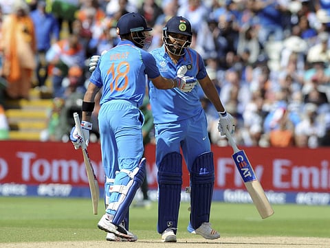 India captain Virat Kohli left congratulates India's Rohit Sharma after he reached a century during the ICC Champions Trophy semifinal match between Bangladesh and India at Edgbaston in Birmingham England Thursday June 15 2017.  | AP