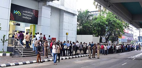 A serpentine queue of commuters waiting for a metro ride in front of  Palarivattom Metro Station in Kochi. The Kochi Metro opened to the public on Monday , 19 June, 2017. (Express | Albin Mathew)