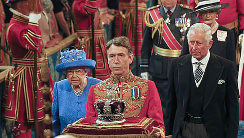 Britain's Queen Elizabeth II and Prince Charles, right, walk through the Royal Gallery in the Houses of Parliament prior to the Queen making The Queen's Speech during the State Opening of Parliament in London, Wednesday, June 21, 2017. (Photo | AP)