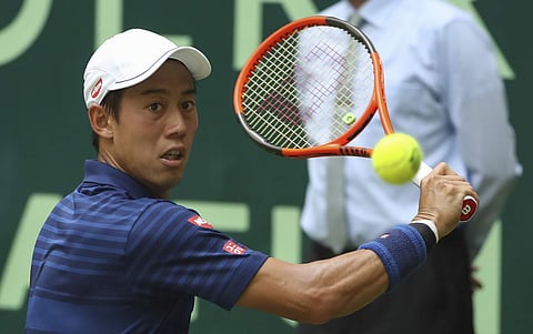 Japan's Kei Nishikori returns a shot to Russia's Karen Khachanov during their match at the Gerry Weber Open tennis tournament. | ap