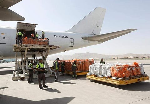 Workers load export materials into a Cargo plane in Kabul, Afghanistan. June 19, 2017. | Reuters