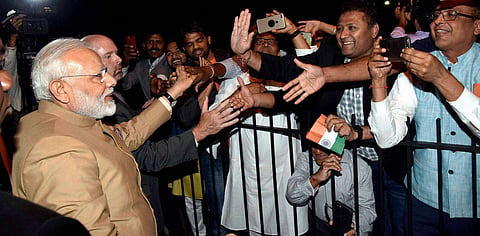 Prime Minister Narendra Modi being warmly welcomed by the people of Indian community on his arrival at Joint Base Andrews Washington DC USA on Sunday. | PTI
