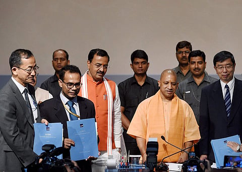 UP CM Yogi Aditiyanath with Takehiko Nakao President Asian Development Bank after signing up of agreement between his government and ADB at Lok Bhawan in Lucknow on Tuesday. (PTI)