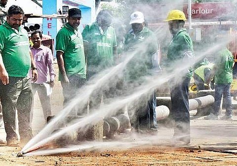 Officials testing the newly  launched mini sewer jetting machines on the  Necklace road in Hyderabad  on Monday| Vinay Madapu