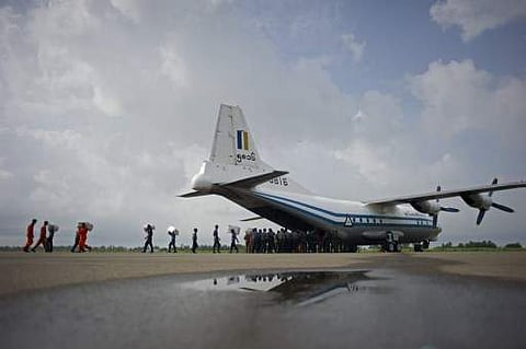 This file photo taken on August 5, 2015 shows a Myanmar Air Force Shaanxi Y-8 transport aircraft being unloaded at Sittwe airport in Rakhine state, similar to the aircraft carrying over 100 people that went missing between the southern city of Myeik and Y