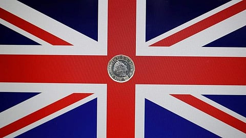 A one pound coin lies on a Union Flag in a photo illustration. (File | Reuters)