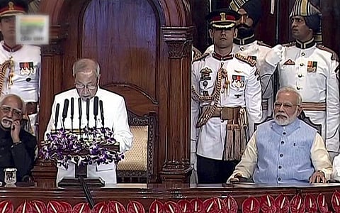 President Pranab Mukherjee addresses the special ceremony in the Central Hall of Parliament for the launch of 'Goods and Services Tax GST ' in New Delhi on Saturday. Prime Minister Narendra Modi is also seen.  (PTI)